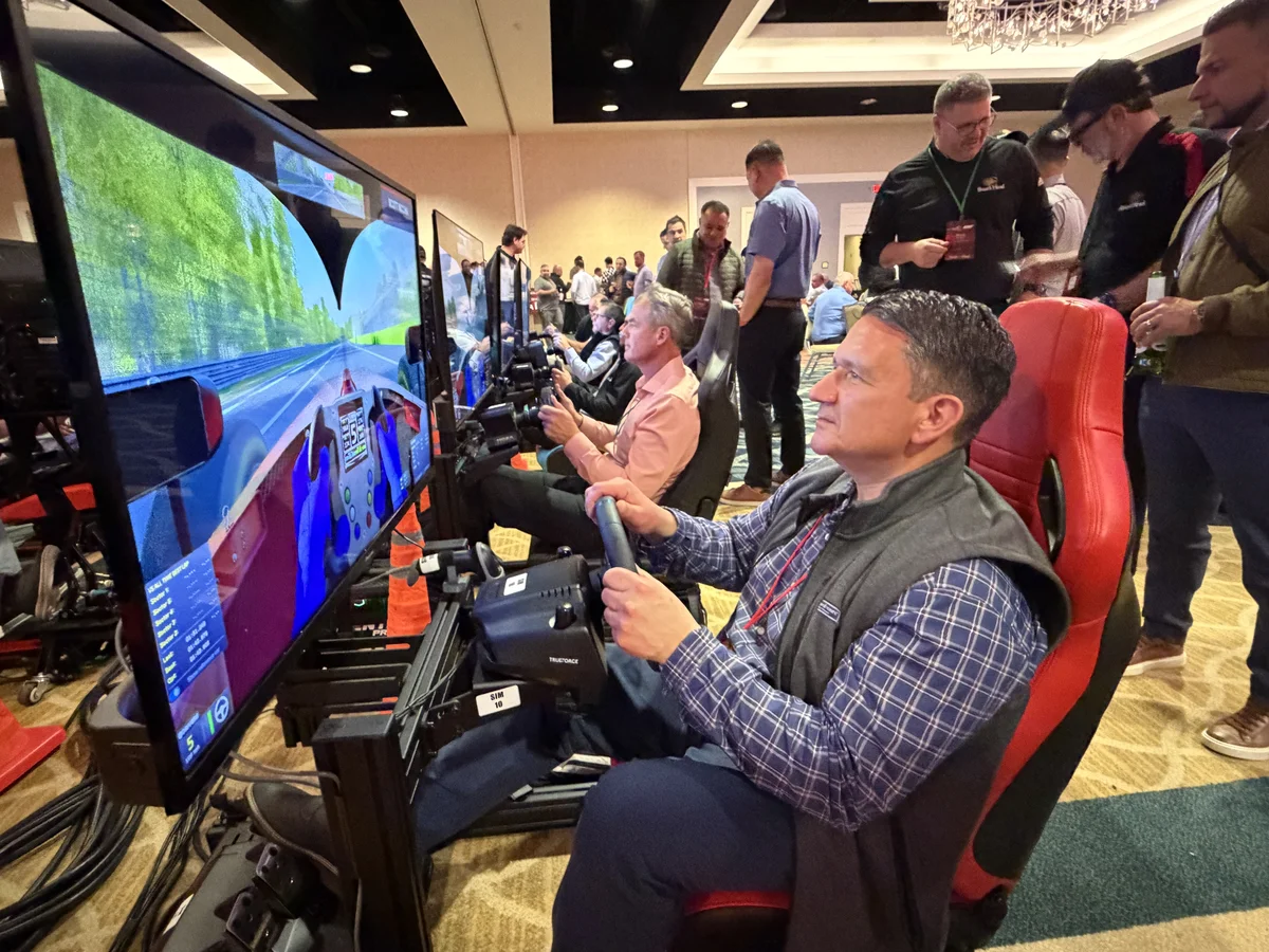 Corporate event with racing simulators in a premium ballroom setting